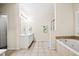 Spacious bathroom with a soaking tub and shower at 1270 Platinum Dr, Hoschton, GA 30548