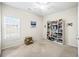 Bedroom with a ceiling fan, natural light, and a bookcase at 1270 Platinum Dr, Hoschton, GA 30548