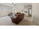 Bright living room with ample seating and natural light, flowing into the kitchen at 1270 Platinum Dr, Hoschton, GA 30548