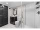 Basement bathroom offering a modern shower and sink, as well as a toilet at 2746 Hedgewood Nw Dr, Atlanta, GA 30311