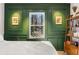 Close up of bedroom showcasing green trim, two windows, and a wooden bookshelf at 2746 Hedgewood Nw Dr, Atlanta, GA 30311