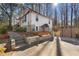 Exterior of home with a walkout basement and a storage building at 2746 Hedgewood Nw Dr, Atlanta, GA 30311