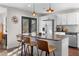 Modern kitchen featuring stainless steel appliances, quartz countertops, an island, and designer lighting at 2746 Hedgewood Nw Dr, Atlanta, GA 30311