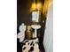 Powder room with modern sink, gilded mirror, and dark walls at 4665 Guilford Forest Sw Dr, Atlanta, GA 30331