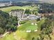 An aerial perspective highlights the lush golf course and expansive parking at 47 Cuthbert Ln Ne, Acworth, GA 30101