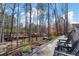 Outdoor patio with chairs and landscaped backyard at 47 Cuthbert Ln Ne, Acworth, GA 30101