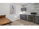 Basement wet bar featuring modern cabinetry, stainless steel appliances, and elegant countertops at 47 Cuthbert Ln Ne, Acworth, GA 30101