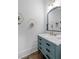 Chic bathroom featuring a vanity with marble countertop, decorative mirror, and unique wall decor at 47 Cuthbert Ln Ne, Acworth, GA 30101