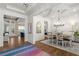 Elegant dining room featuring a modern chandelier, hardwood floors, and an open-concept layout at 47 Cuthbert Ln Ne, Acworth, GA 30101