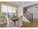 Bright dining room with modern lighting, staircase, and hardwood floors at 47 Cuthbert Ln Ne, Acworth, GA 30101