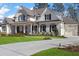 Charming two-story home with a brick exterior, black shutters, and a well-kept front lawn at 47 Cuthbert Ln Ne, Acworth, GA 30101