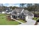 Stunning two-story home with a well-manicured lawn, a covered porch, and a three-car garage at 47 Cuthbert Ln Ne, Acworth, GA 30101