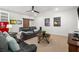 Relaxing living room with comfortable sofas, a ceiling fan, barn door, a retro-style refrigerator and tasteful decor at 47 Cuthbert Ln Ne, Acworth, GA 30101