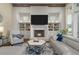 Cozy living room with a fireplace, built-in shelving, and comfortable seating arrangement at 47 Cuthbert Ln Ne, Acworth, GA 30101