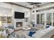 Bright living room featuring a fireplace, built-in shelving, and expansive windows with views of the outdoors at 47 Cuthbert Ln Ne, Acworth, GA 30101