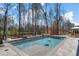 Beautiful in-ground swimming pool with stone surround, perfect for relaxing and entertaining at 47 Cuthbert Ln Ne, Acworth, GA 30101