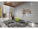 Modern kitchen featuring stainless steel range, pot filler, and gray tile backsplash at 47 Cuthbert Ln Ne, Acworth, GA 30101