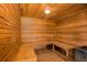 Wood-paneled sauna with built-in benches and a traditional heater at 47 Cuthbert Ln Ne, Acworth, GA 30101