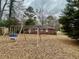 Backyard features an open lawn area with a swing set at 2956 Cruse Rd, Lawrenceville, GA 30044