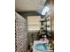 Bathroom boasts a blue sink, patterned shower curtain, and wall shelves at 2956 Cruse Rd, Lawrenceville, GA 30044