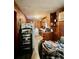 Features a combination kitchen/laundry room with wood panels and updated appliances at 2956 Cruse Rd, Lawrenceville, GA 30044