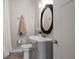 Stylish bathroom featuring oval mirror, sleek vanity with vessel sink, and modern fixtures at 1686 Terry Mill Se Rd, Atlanta, GA 30316