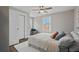 Cozy bedroom with natural light, ceiling fan, closet, and stylish decor at 1686 Terry Mill Se Rd, Atlanta, GA 30316