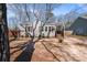 Charming home featuring a manicured lawn, inviting front porch, and freshly painted exterior at 1686 Terry Mill Se Rd, Atlanta, GA 30316