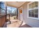 Charming front porch featuring a decorative wreath, wood railings, and view of a neighborhing home at 1686 Terry Mill Se Rd, Atlanta, GA 30316