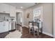 Charming kitchen features stainless steel appliances, white cabinets, wood-look floors, and a breakfast nook at 1686 Terry Mill Se Rd, Atlanta, GA 30316