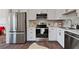 Well-equipped kitchen with stainless steel appliances, white cabinets, and updated countertops at 1686 Terry Mill Se Rd, Atlanta, GA 30316