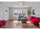 Cozy living room showcasing hardwood floors, bright windows, and stylish contemporary decor at 1686 Terry Mill Se Rd, Atlanta, GA 30316