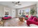 Bright and airy living room with large windows, hardwood floors, and stylish modern furniture at 1686 Terry Mill Se Rd, Atlanta, GA 30316