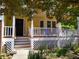 Charming front porch with white lattice and railings, perfect for relaxing outdoors at 3423 Conley Downs Dr, Powder Springs, GA 30127