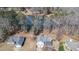 Aerial view of a home, showing the layout of the property, surrounding neighborhood, and nearby lake at 3423 Conley Downs Drive, Powder Springs, GA 30127