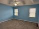 Spacious bedroom with two windows and neutral carpeting at 3423 Conley Downs Drive, Powder Springs, GA 30127