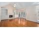 Cozy living room featuring hardwood floors, a fireplace with built-ins, and sliding door at 3423 Conley Downs Drive, Powder Springs, GA 30127