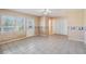 Bright living room featuring tile floors, large windows, and a door to the outside at 3423 Conley Downs Drive, Powder Springs, GA 30127