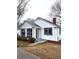 Charming home with a screened-in porch, gray-trimmed windows, and a brick chimney at 5091 Newark Ave, Clarkdale, GA 30111