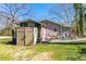 Exterior view of the home with a hammock, chairs, and storage shed at 842 Third St, Stone Mountain, GA 30083