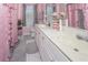 Bathroom featuring double vanity, decorative accents and frilly decor at 1009 S Creek Dr, Villa Rica, GA 30180