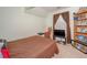 Bedroom featuring a window, TV, and open shelving at 1009 S Creek Dr, Villa Rica, GA 30180