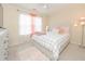 Cozy bedroom with a queen bed, plush rug, and lots of natural light from a large window at 1009 S Creek Dr, Villa Rica, GA 30180