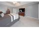 Spacious bedroom features plush carpeting, neutral tones, and tray ceiling at 1009 S Creek Dr, Villa Rica, GA 30180
