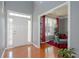 Bright foyer with a view into the adjacent living room decorated with a Christmas tree and red accents at 1009 S Creek Dr, Villa Rica, GA 30180