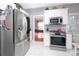 Modern kitchen features stainless steel appliances and a view of the game room at 1009 S Creek Dr, Villa Rica, GA 30180