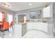 Modern kitchen featuring stainless steel appliances, white cabinets, countertops, and stylish white marble-look flooring at 1009 S Creek Dr, Villa Rica, GA 30180