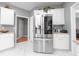 Kitchen featuring stainless steel refrigerator and white cabinets at 1009 S Creek Dr, Villa Rica, GA 30180