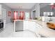 Bright kitchen with white cabinets, stainless steel appliances, and a view to dining area at 1009 S Creek Dr, Villa Rica, GA 30180