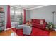 Bright living room with a festive Christmas tree, red accents, and hardwood floors at 1009 S Creek Dr, Villa Rica, GA 30180